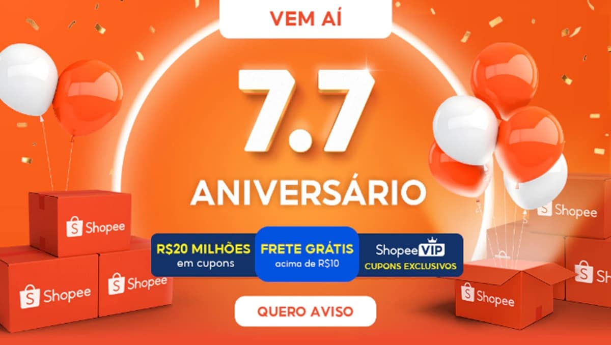 Banner 7.7 Aniversário Shopee com balões laranjas, brancos e confetes dourados sobre fundo laranja vibrante